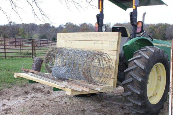 3-Point Carry All with a wooden pallet and barbed wire