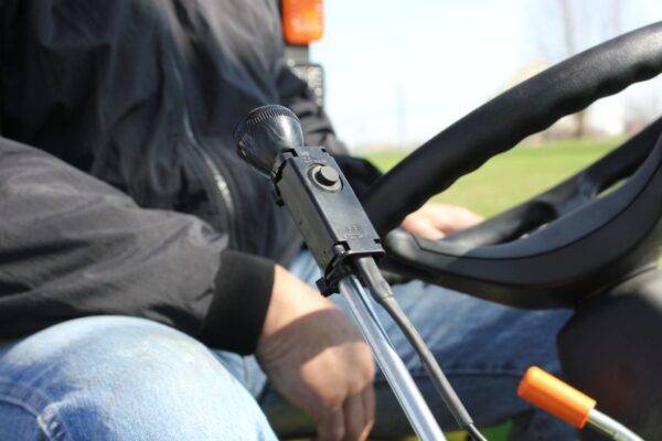 man operating the Sub Compact Grapple