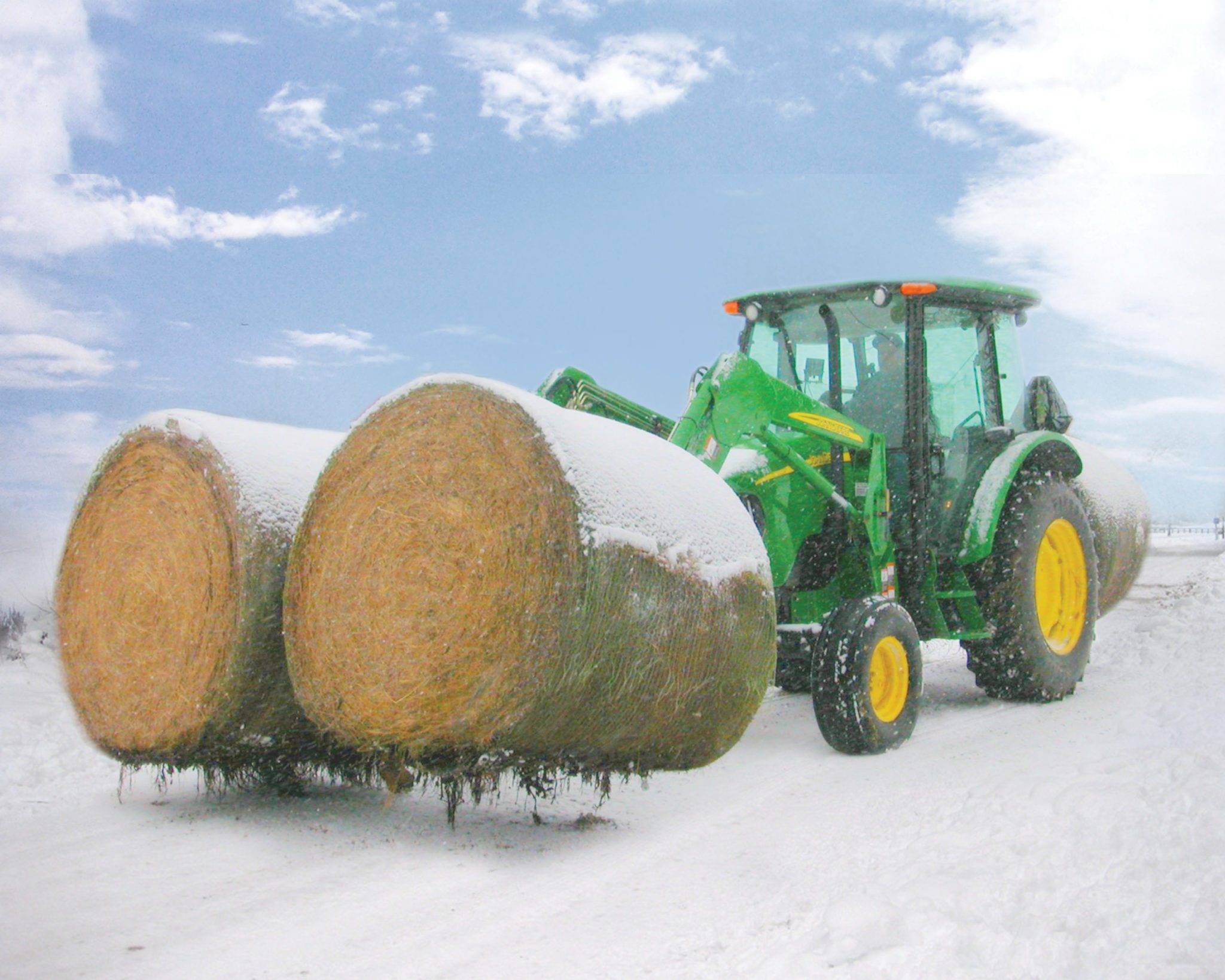 John Deere Two Bale Mover lifting two bales